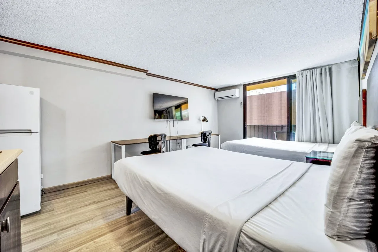 right, guest-ready studio featuring fresh white paint and efficient split A/C for short-term rental use.