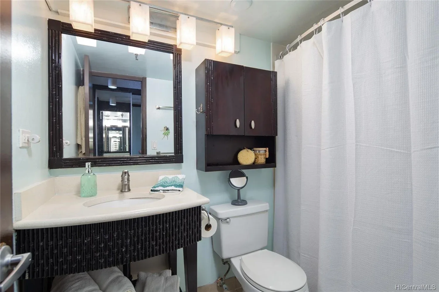 Outdated bathroom with aging tile and fixtures prior to remodel.